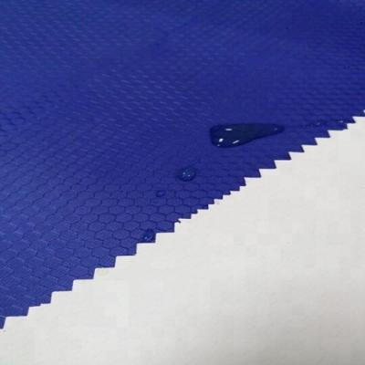 China Waterproof cheap jacquard football ripstip taffeta fabric with pvc coated for raincoat for sale