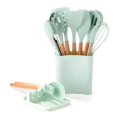 China Newest Sustainable Wooden Handle 12Pcs Silicone Kitchenware Set With Container for sale