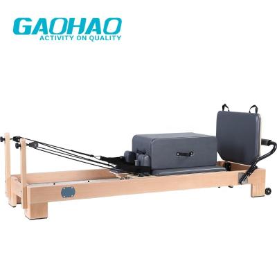 China Gaohao Size Quality High Density Pilates Reformers Press Adjustable Wooden Balanced Pilates Machine Included Pilates Accessories for sale