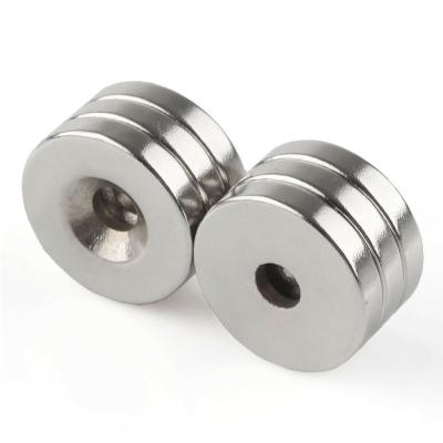 China N42 Hole Neodymium Magnets Rare Earth Industrial Disc Milled Strong Permanent Magnets With Screws for sale