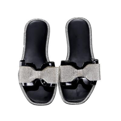 China Fashion Trend Women Summer Rhinestone Indoor Outdoor Bowknot Shiny Colorful Flat Toe Sandal Open Strap Slipper for sale