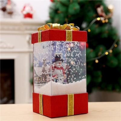 China Christmas Decoration Plastic Popular Gift Box Musical Gift Box With Lighted Snowfall Gift Box With Music for sale