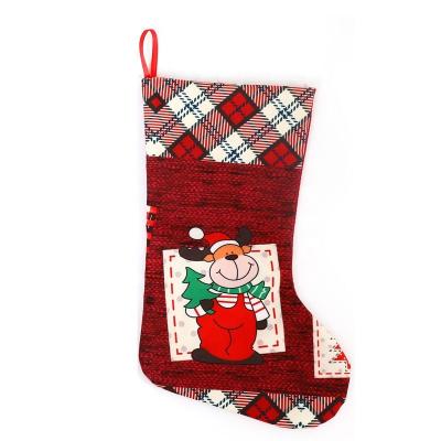 China Classic Nonwoven Fabric Reindeer Gift Stocking Socks Christmas Stocking Socks With Santa Snowman Reindeer Candy Stocking Bag for sale