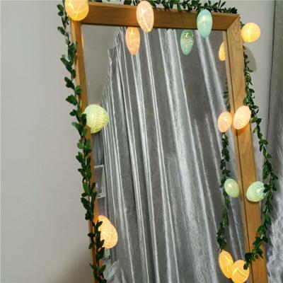 China Indoor Decoration Easter Green Leaf Egg String Lights Cracked LED Egg Color Lights Party Decorative Green Rattan String Lights for sale