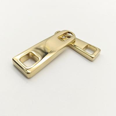 China Custom Health And Environment Brand Logo Zip Puller Garment Metal Zipper Puller Slider for sale