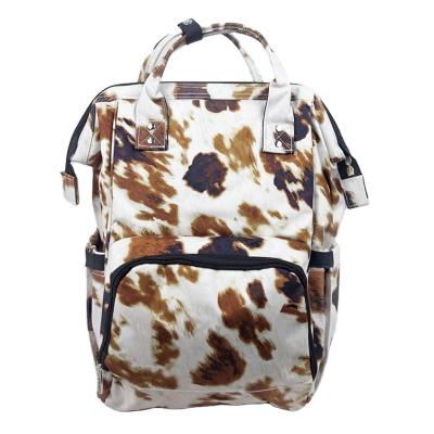 China Custom Diaper Bag Monogram Cow Print Canvas Diaper Backpack Wholesale Water Resistant for sale