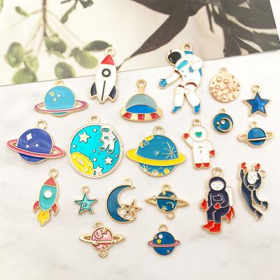 China Cute Spaceship Rocket Astronaut DIY Jewelry Accessories Cartoon Planet Charms For Jewelry Making for sale