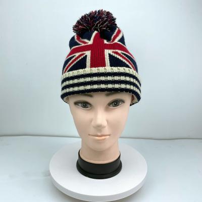 China JOINT Custom Embroidered Jacquard Knitted Beanie Hat with pom pom, flip hat for sale