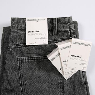 China Sustainable Jeans Tag Center Fold Paper Size Tags Folding Tag For Jeans Pants for sale