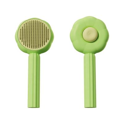 China Viable Self Cleaning Sunflower Shaped Press Needle Brush Hair Removal Massage Cat Dog Pet Grooming Comb for sale