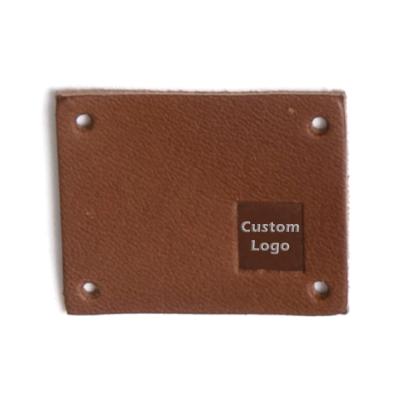 China Sustainable Accessory Manufacturer Custom Design Leather Patch Debossed Leather Logo Label For Jeans Clothing Cap for sale