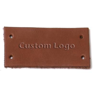 China Viable factory direct custom logo embossed garment tag genuine/pu leather label for clothing and jeans for sale