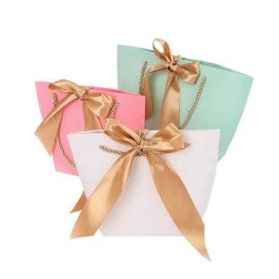 China Top Quality Materials Recycled Personalized Pink And White Luxury Gift Small Shopping Paper Bag With Ribbon for sale