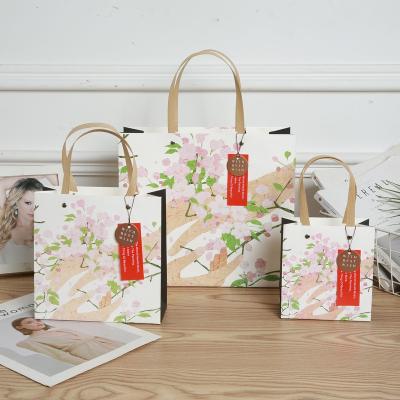 China Recycled Materials Customized Print Logo White Gift Shopping Luxurious Fashion Pape Bag for sale