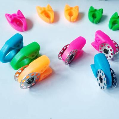 China Silicone 12 Piece Assorted Color Sewing Tools Accessories Thread Spools Holders Clamps for sale