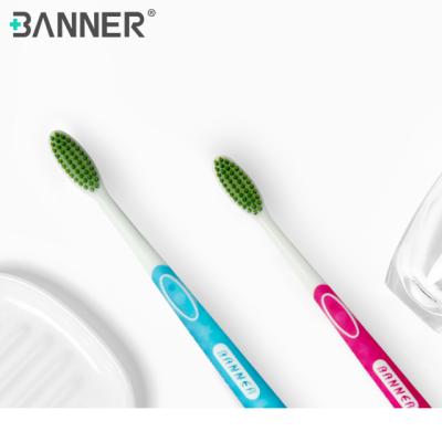 China Soft Adult Soft Two Tone Green Tea Stiffens Deep Clean Manual Toothbrush for sale