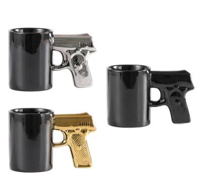 China Viable Custom Ceramic White Black Gun Shaped Creative Simple Handle Water Coffee Mug Milk Tea Mug for sale