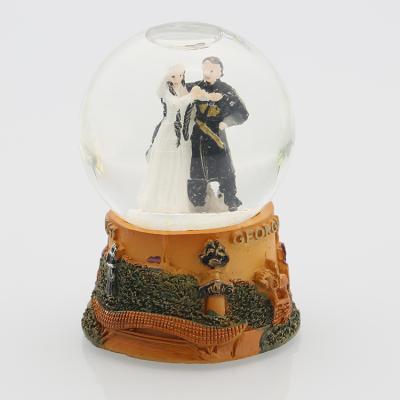 China 45mm Diameter Hand Made Water Ball Georgia Souvenir Snow Globe With Resin Base for sale