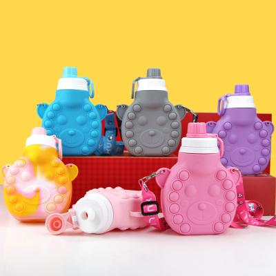 China 2022 Viable Wholesale Push Bubbles Hot Drink Purses Handbag Pop Reusable Stir Portable Kids Silicone Water Bottle for sale