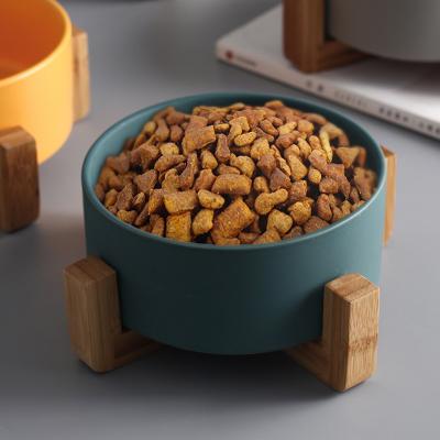 China Customized Viable Colorful Ceramic Puppy Cat Pet Bowl Pet Feeder With Bamboo Holder for sale