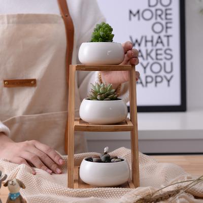 China Small modern creative three layers of bamboo shelf with round shape ceramic white flower pot for sale