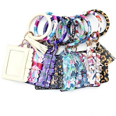 China New Eco-friendly Leopard Printing PU Tassel Wristband Key Chain Coin Purse Card Holder Female Clutch Document Bag for sale