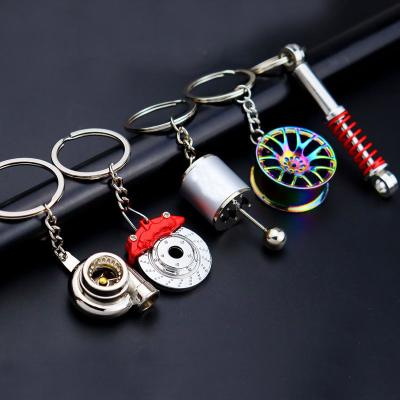 China Fashionable creative gear hub key chain turbo metal car gift pendant brake disc shock absorber for sale