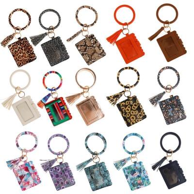 China Environmentally Friendly Key Chain Bracelet Ring Bracelets Card Holder PU Leather Key Chain Purse With Tassel For Women Girls for sale