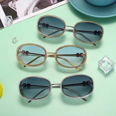 China Fashion Sunglasses Wholesale Oval Steampunk Crystal Hollow Engrave Metal Frame Sun Glass Luxury Rhinestone Sun Glasses For Women for sale