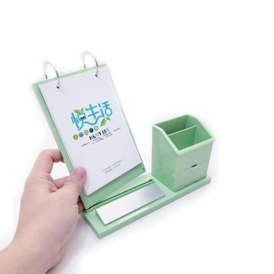 China Desk Calendar Plastic Opens New Year 2021 Calendar Holder with Pen Holder for sale