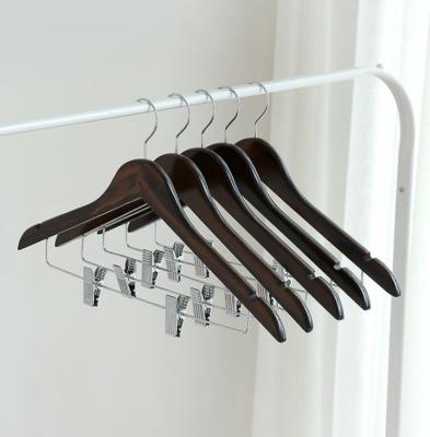 China With notches wooden hanger with clips wooden hotel and home use fabrics hangers for sale