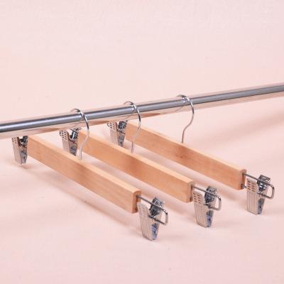 China Lotus Eco-friendly Material Wooden Pant Hangers Skirt Hanger With Metal Clips 360 Hanger Hook for sale