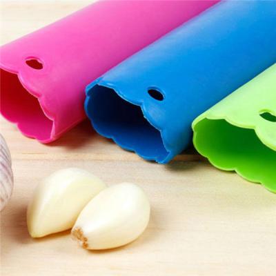 China Viable Accessories Creative Tools Kitchen Silicone Garlic Peeler Magic Soft Skin Cooking Crusher Utensils for sale