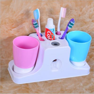 China Wall Mountable Suction Toothpaste Dispenser Automatic Toothpaste Holder Toothpaste Tube for sale