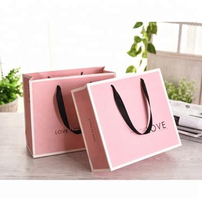 China WZD15-4 Fashion Recyclable Paper Shopping Bag Custom 300 Pieces Door Decorative Gift Paper Bag With Handles for sale