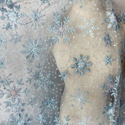 China Viable Blue Mesh Embroidery Snowflake Sequins Clothing Fabric For Women's Dress for sale