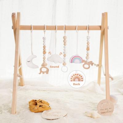 China Educational Toy Wooden Baby Play Gym with 6 Toys Frame Foldable Activity Bar Hanging Gift Baby Boy Newborn Gym for sale