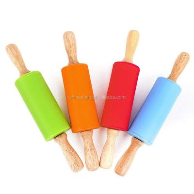 China Sustainable Food Grade 4 Inch Mini Silicone Pin Gun Stick Pastry Baking Tools With Wooden Handle for sale