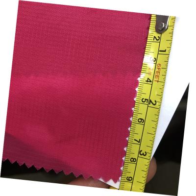 China 70D water resistant factory price ripstop 210t nylon ripstop fabric for sportswear liner bag tent for sale