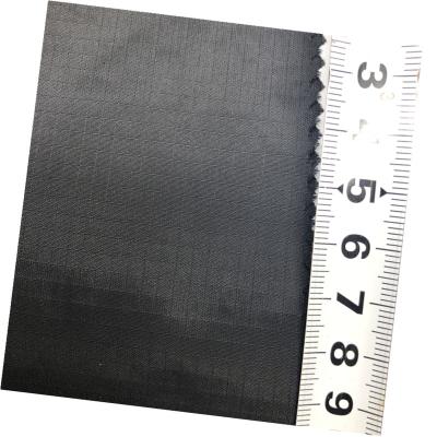 China Jacquard 100% Nylon Water Resistant Stretch RIpstop Plaid Fabric 40D 300T For Liner And Coat for sale