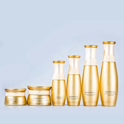 China Personal Care Yellow Lotion Pump Glass Bottle Cosmetic Glass Jar Customize Eye Cream Face Cream 30g 50g for sale