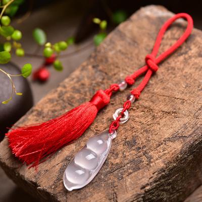 China Hand-carved Crystal Natural Milky Green Bean Car Decoration White Crystal Pendant Means Travel Safe And Can Bring Good Luck for sale