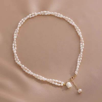 China Elegant and generous pearly and delicate retro style Niche BOHEMIA rice natural freshwater pearl double-layer necklace wholesale for sale