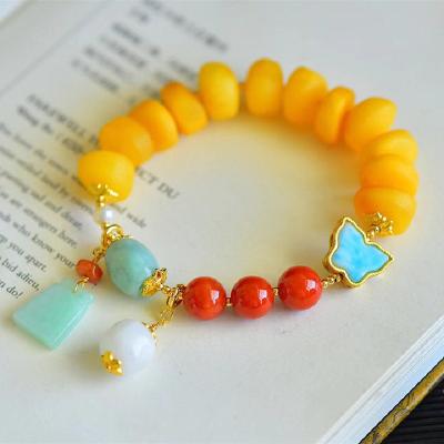 China The old romantic natural beeswax multi-treasure bracelet can speed up metabolism and relieve aging energy. Nice gift for sale