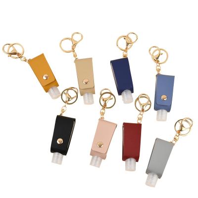 China 30ml Key Chain Travel Portable Empty Leakproof Plastic Bottle For Hand Sanitizer With Tassels Leather Key Chain Holder Carriers for sale