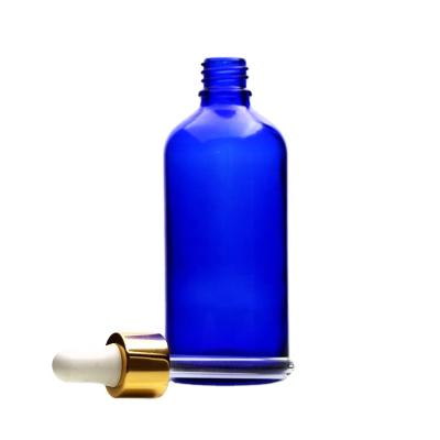 China 50ml Empty Blue Personal Care Boston Round Refillable Essential Oil Bottle With Gold Dropper Dropper Glass Bottle Essential Oil for sale