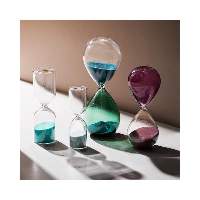 China Europe popular statue living room decoration resin opens accessories new products resin hourglass home timer for sale