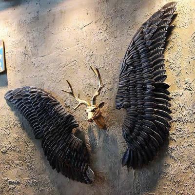 China 2023 Europe Retro Vintage White Black High Quality Color Gold Metal Angel Wings Wall Hanging Decor for sale