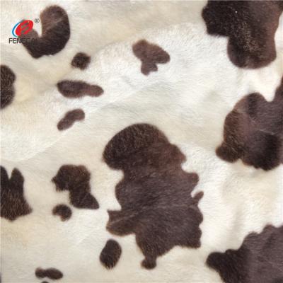 China Anti-Static 100% Polyester Printing Cow Pattern Plush Shorts Pile Velboa Fabric For Sofa Blanket for sale