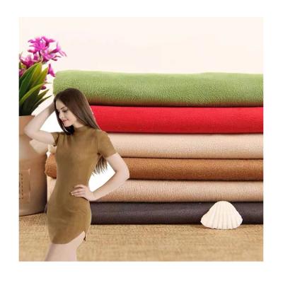 China Competitive price anti-static high quality polyester suede fabric 100% micro suede brush velvet fabric for clothes upholstery for sale